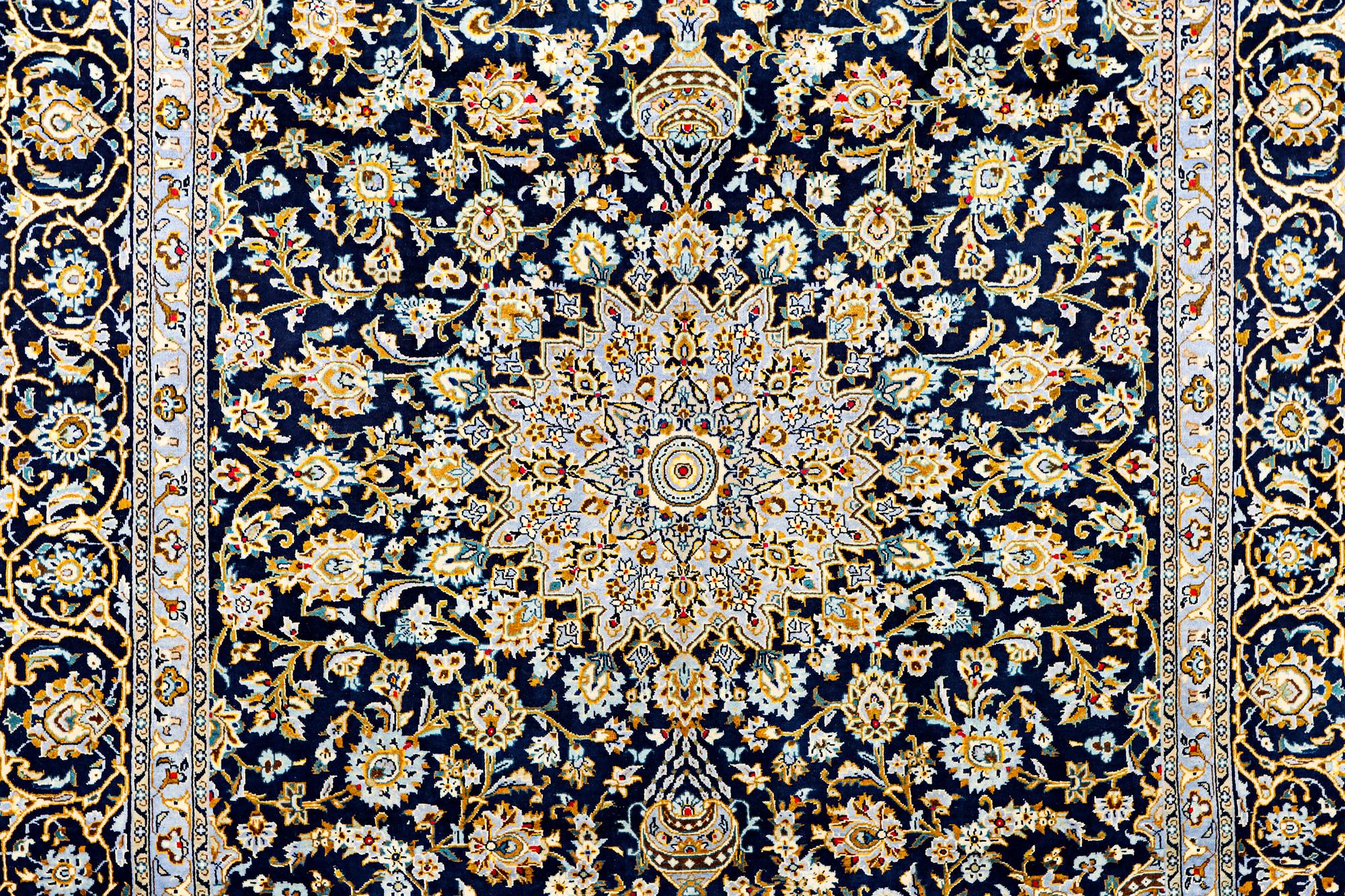 A Kashan carpet, c. 343 x 236 cm.