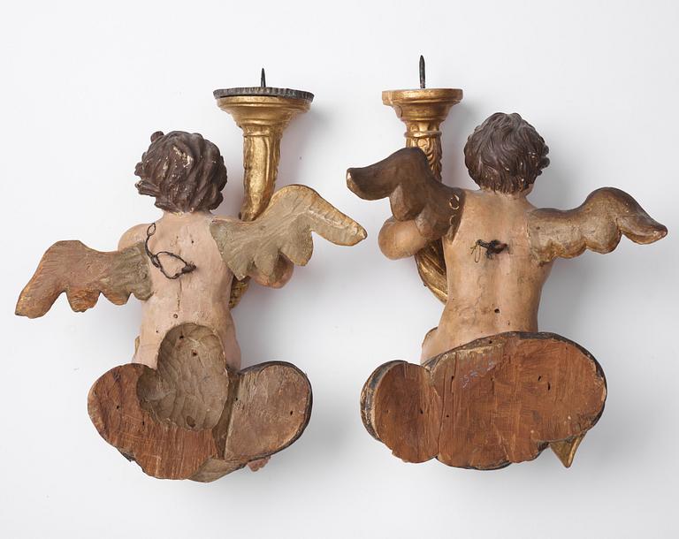 A pair of Baroque candle holders, first half of the 18th century.