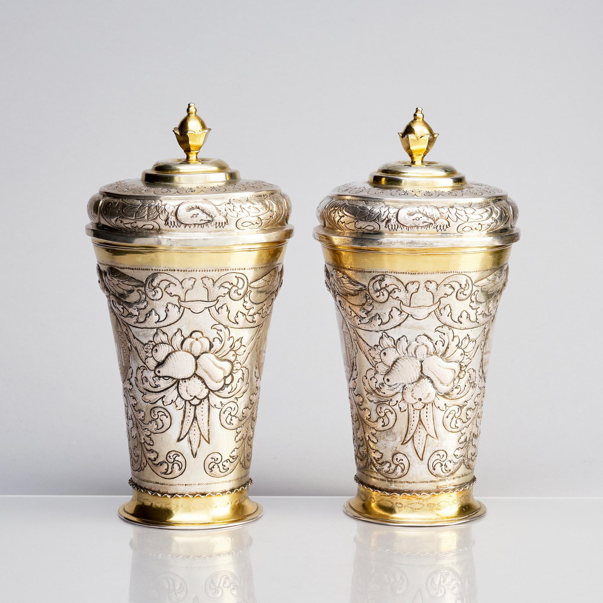 A pair of Russian Baroque parcel-gilt silver cups and covers, mark of Nikifor Timofeev, Moscow 1729.