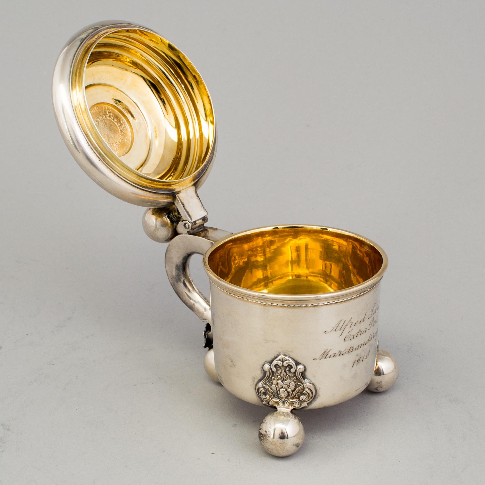 A 20th century parcel-gilt miniature tankard, mark of B Hertz AB, Stockholm 1910.