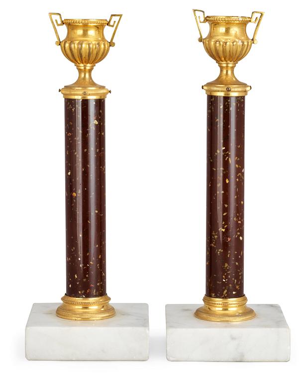 A pair of Swedish 19th century candlesticks, glas imitating porphyry.
