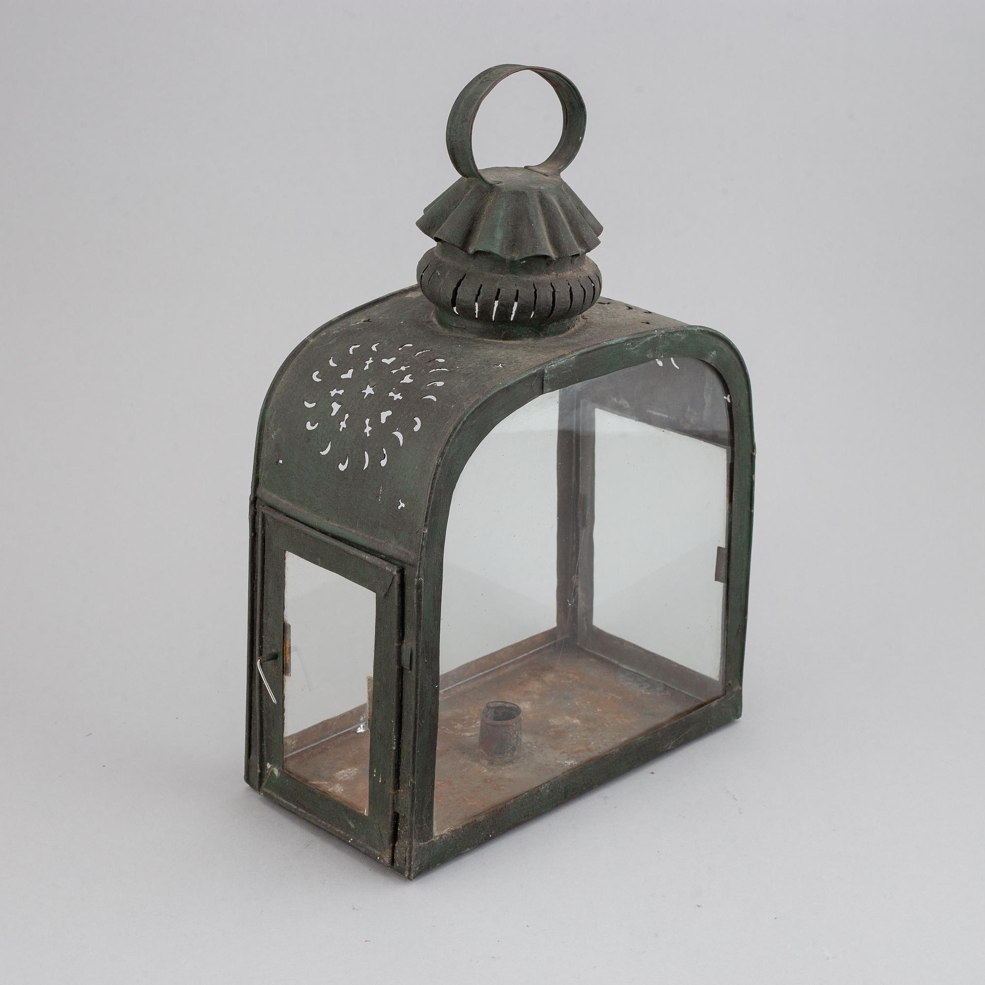 An 18th century tinplate and glass lantern.