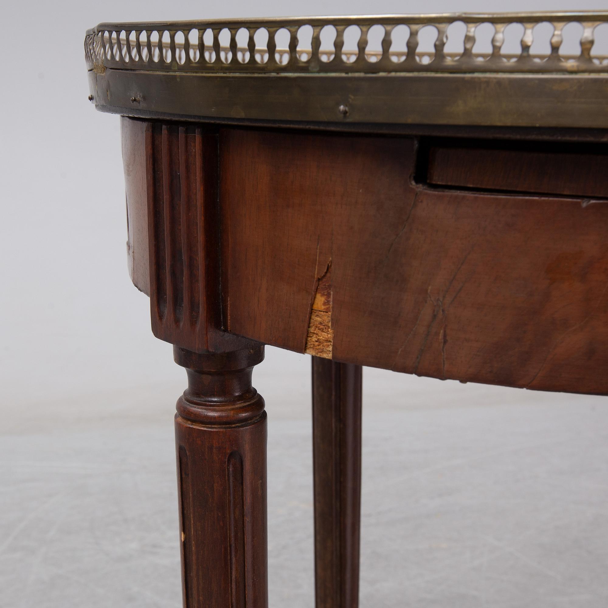 A Louis XVI style marble top mahognay table, circa 1900.