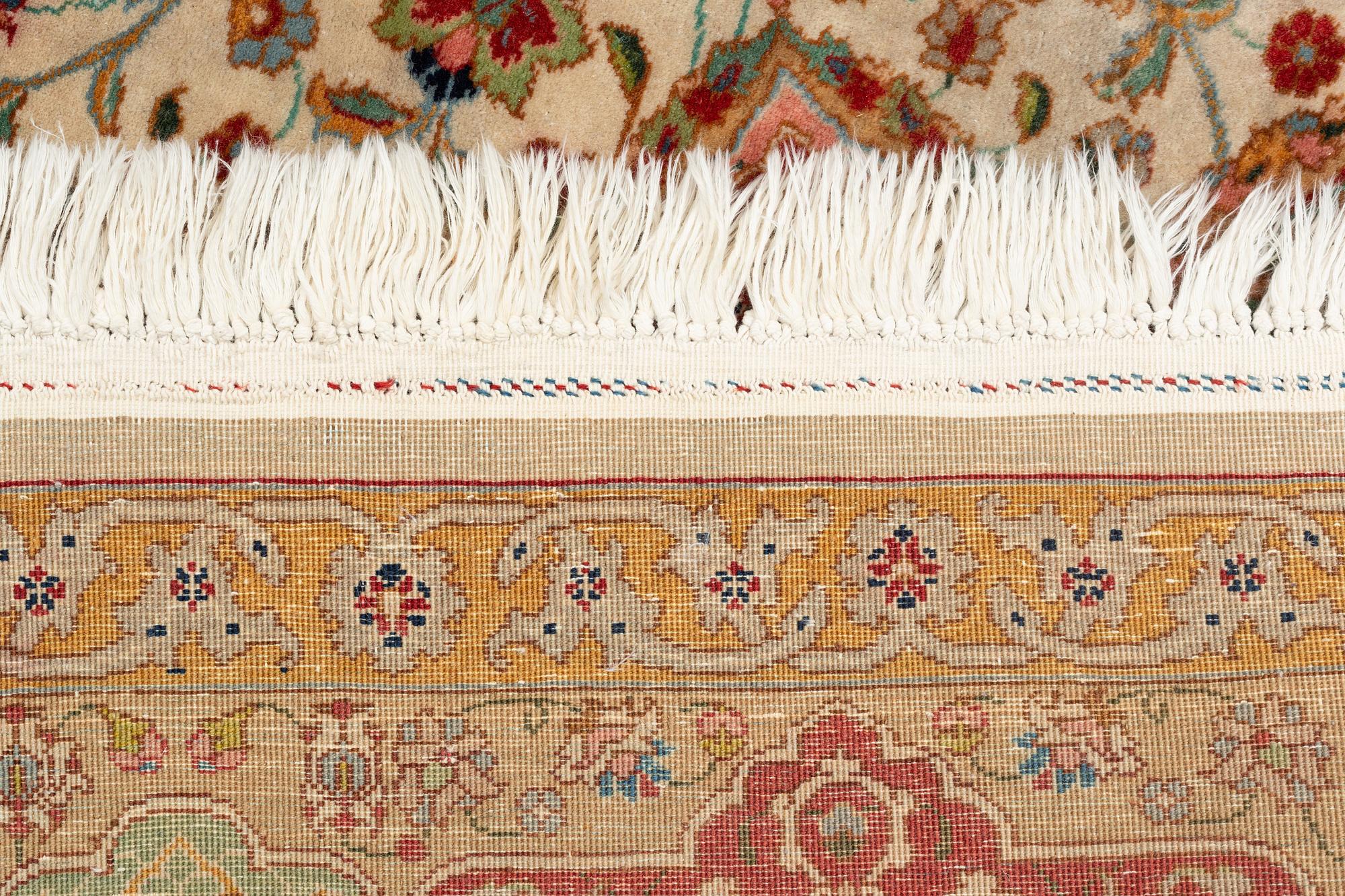 A carpet, semi-antique, Tabriz, ca 298 x  228 cm.