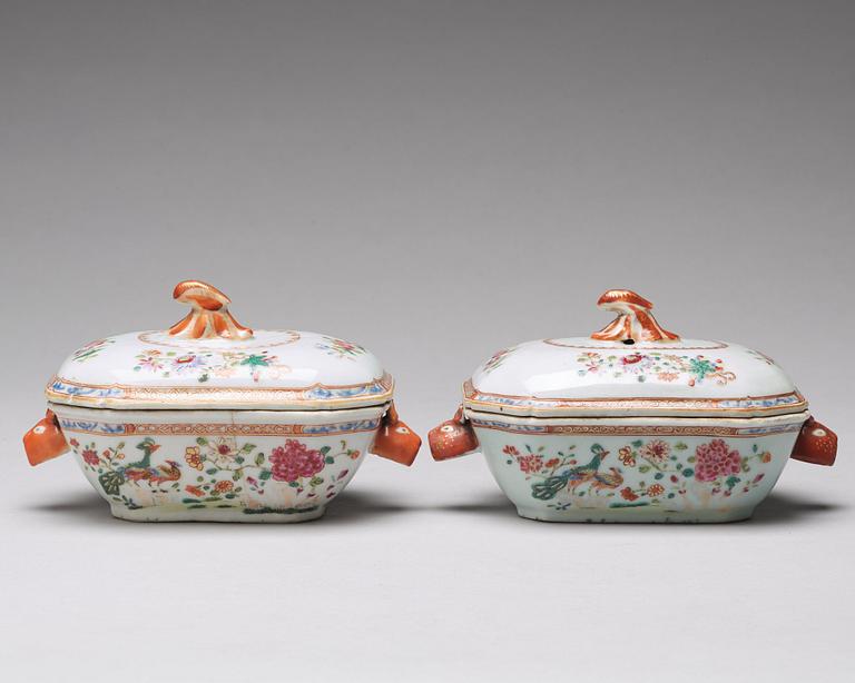 A pair of famille rose 'double peacock' butter tureens with cover and stand, Qing dynasty, Qianlong (1736-95).