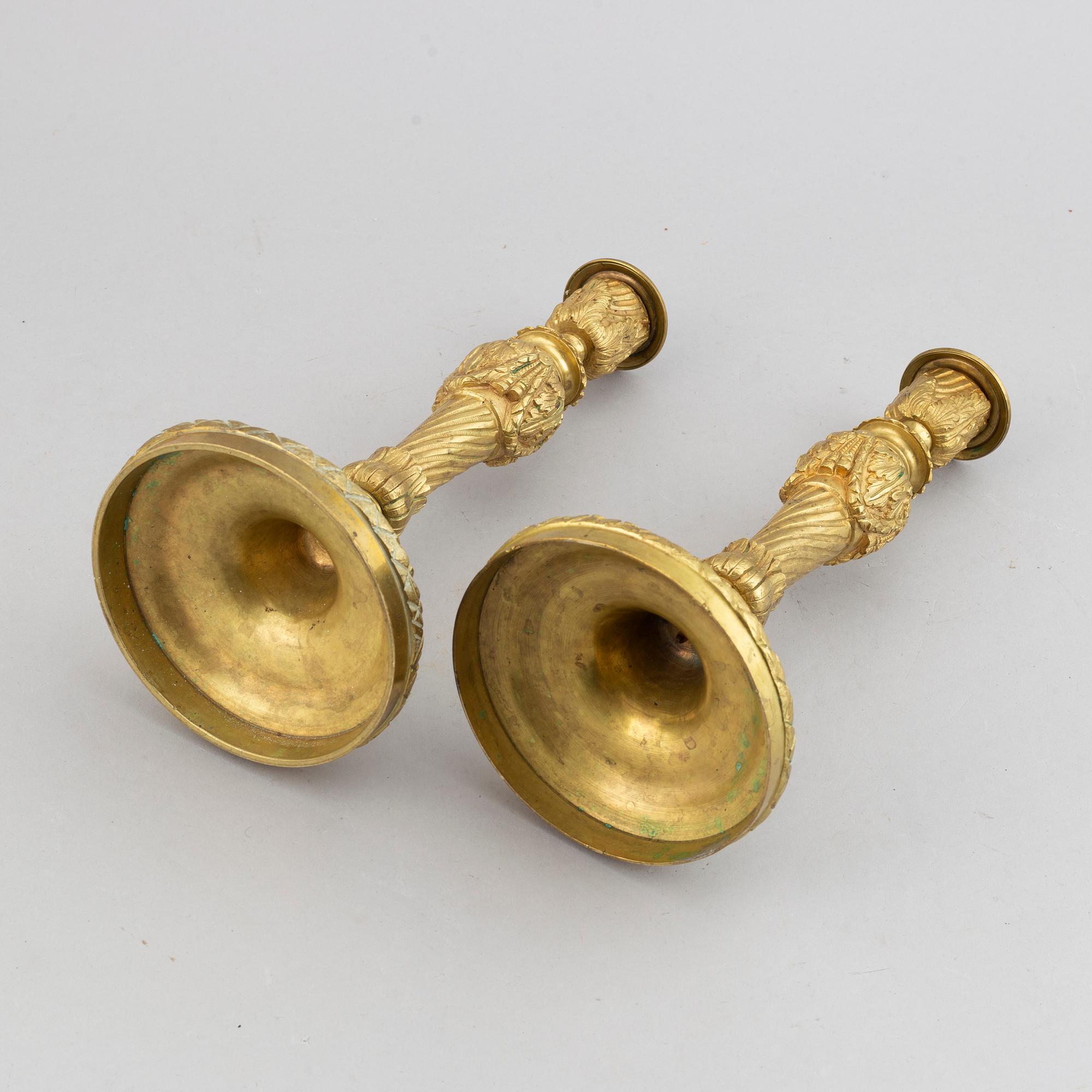 A pair of bronze Louis XV-style candlesticks, circa 1900.