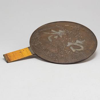 A japanese bronze mirror, 20th Century.