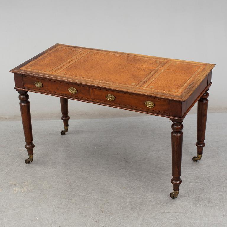 A late 19th century English writing table signed Holland & Sons.