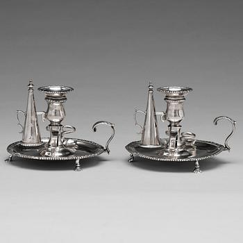 196. An English pair of 18th century silver chamber candlesticks, mark probobly of Ebenezer Coker, London 1770.