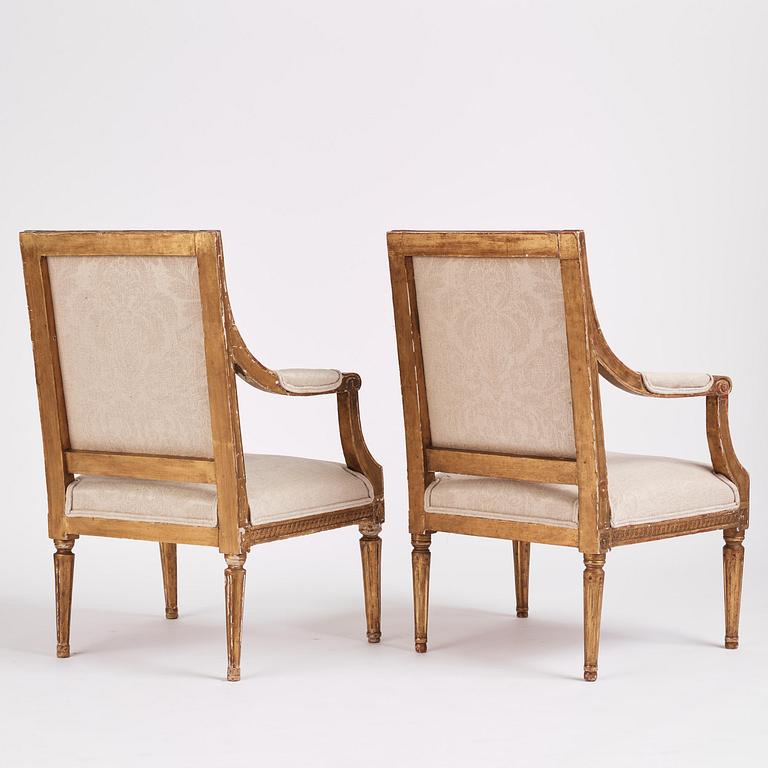 A near pair of Gustavian giltwood fauteuils, Stockholm, late 18th century.