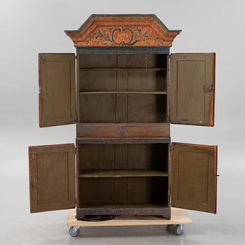 A painted cabinet, dated 1825.