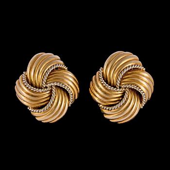 1054. A pair of gold earclips, 1950's.
