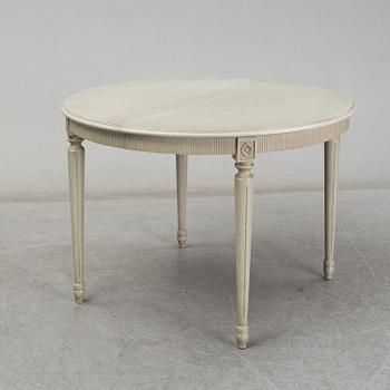 A dining table and six chairs, Gustavian style, second half of the 20th century. One leaf included.