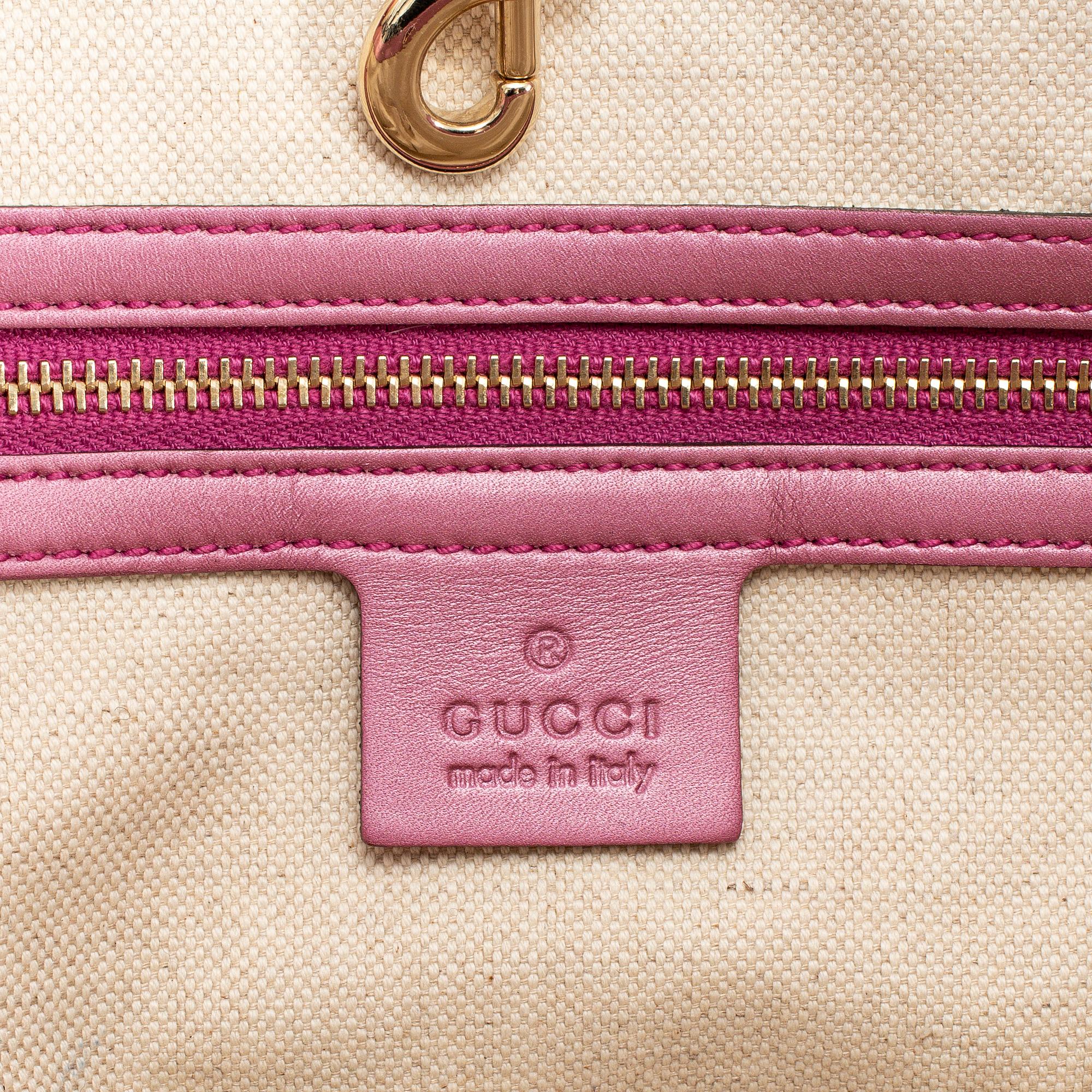 GUCCI, a monogram canvas and pink metallic leather handbag.