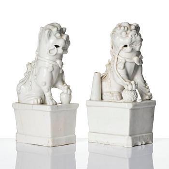 Two blanc de chine figures of buddhist lions/joss stick holders, Qing dynasty, Kangxi (1662-1722).