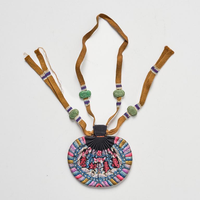 A set of three embroidered purses/ eye-glass cases, Qing dynasty, 19th century.