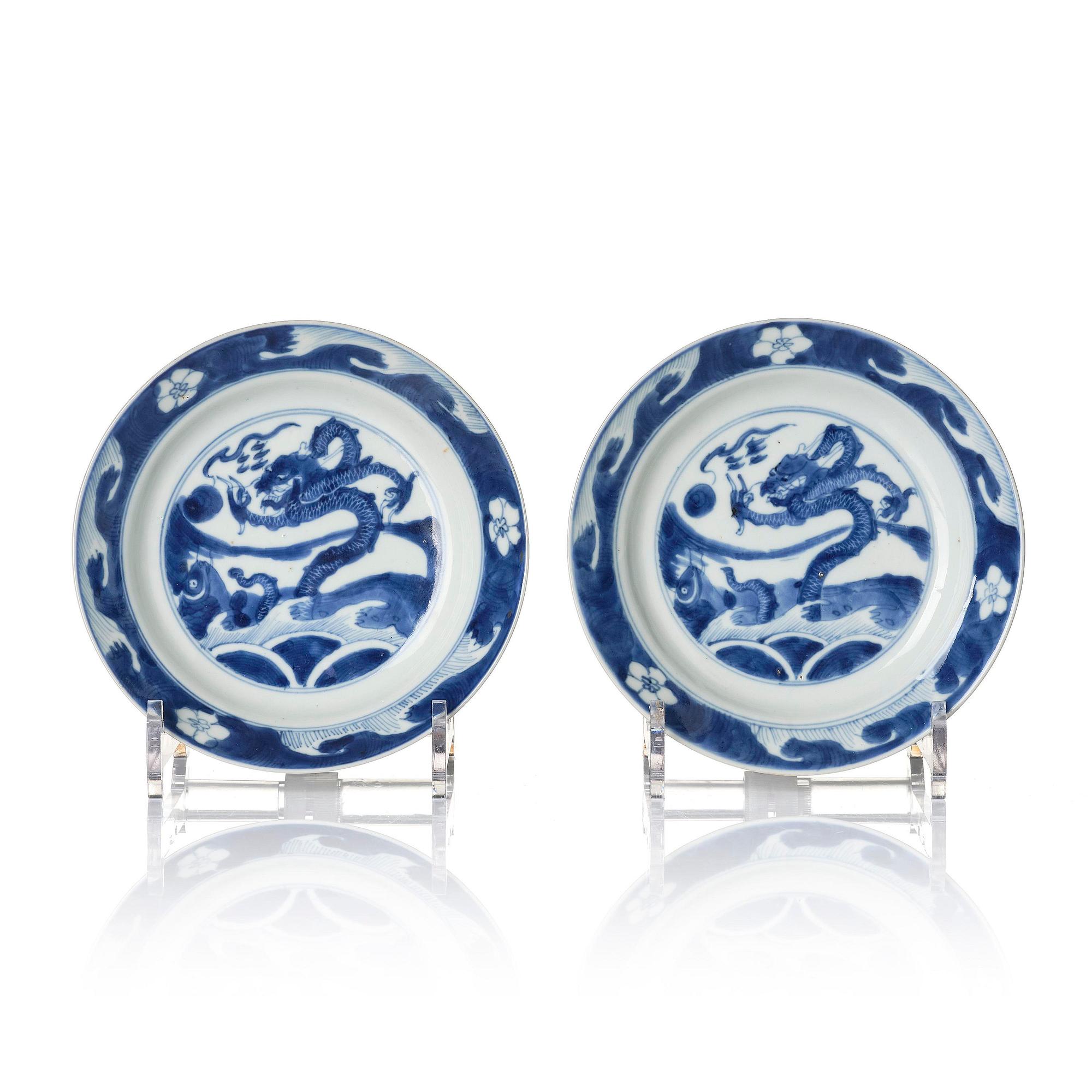 A pair of blue and white 'dragon and fish dishes', Qing dynasty, Kangxi (1662-1722).