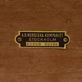 A mid 20th century mahogany veneered table from Nordiska Kompaniet (NK).