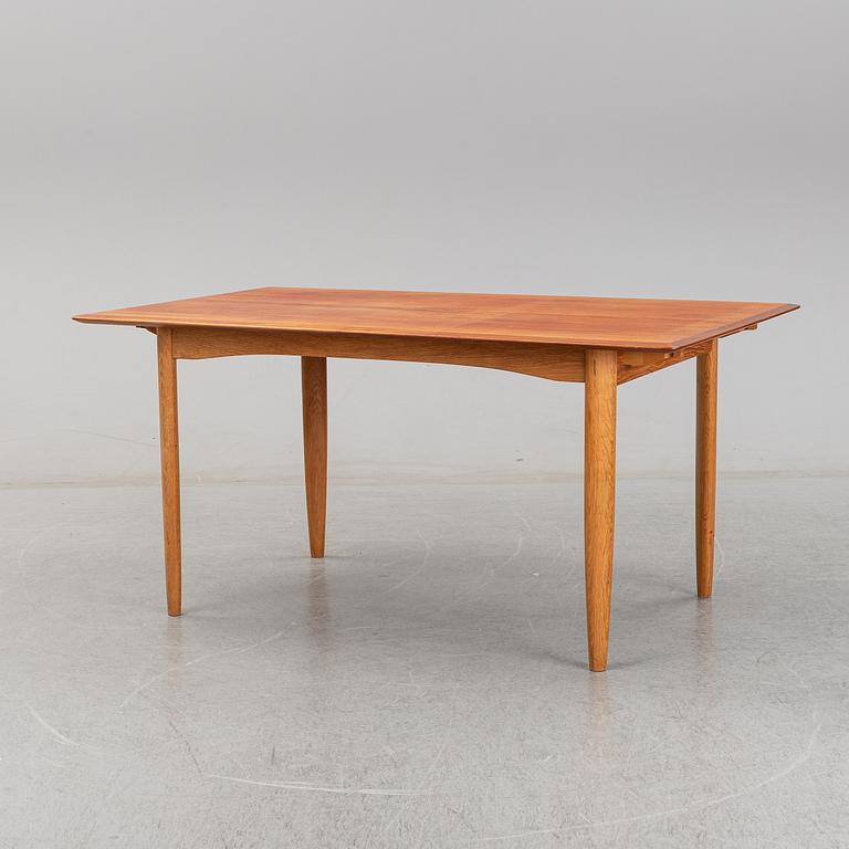 A 1950/60's dining table from Slagelse Møbelvaerk A/S with two additional leaves.