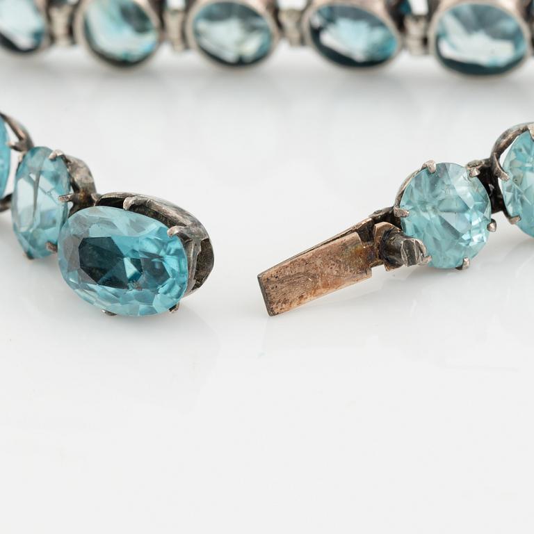 Silver and blue zircon bracelet.