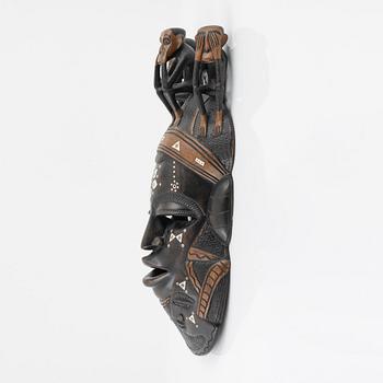 A wooden mask, Gambia, 21st Century.