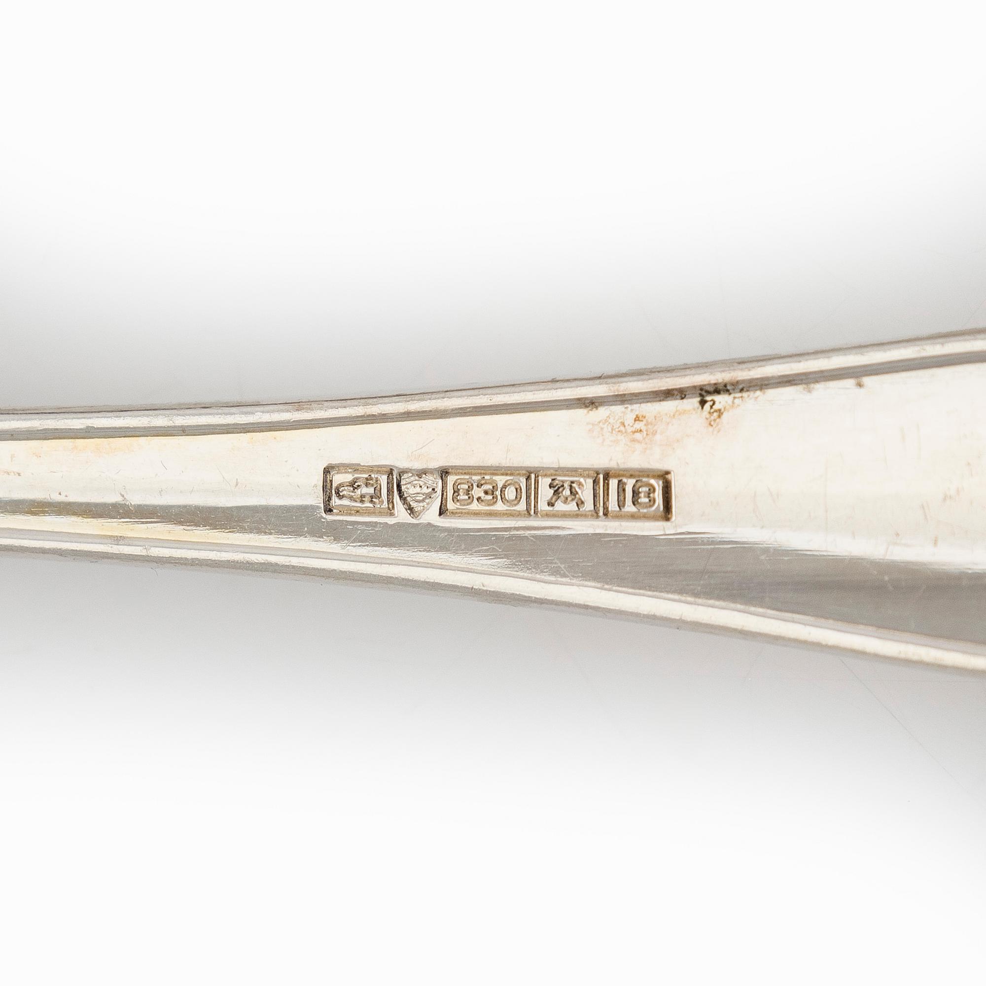 An 118-piece set of 'Chippendale' silver cutlery, Finnish hallmarks. In cutlery box.