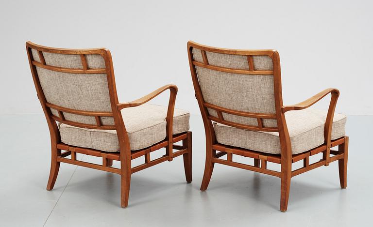 A pair of Carl-Axel Acking easy chairs by NK circa 1946.