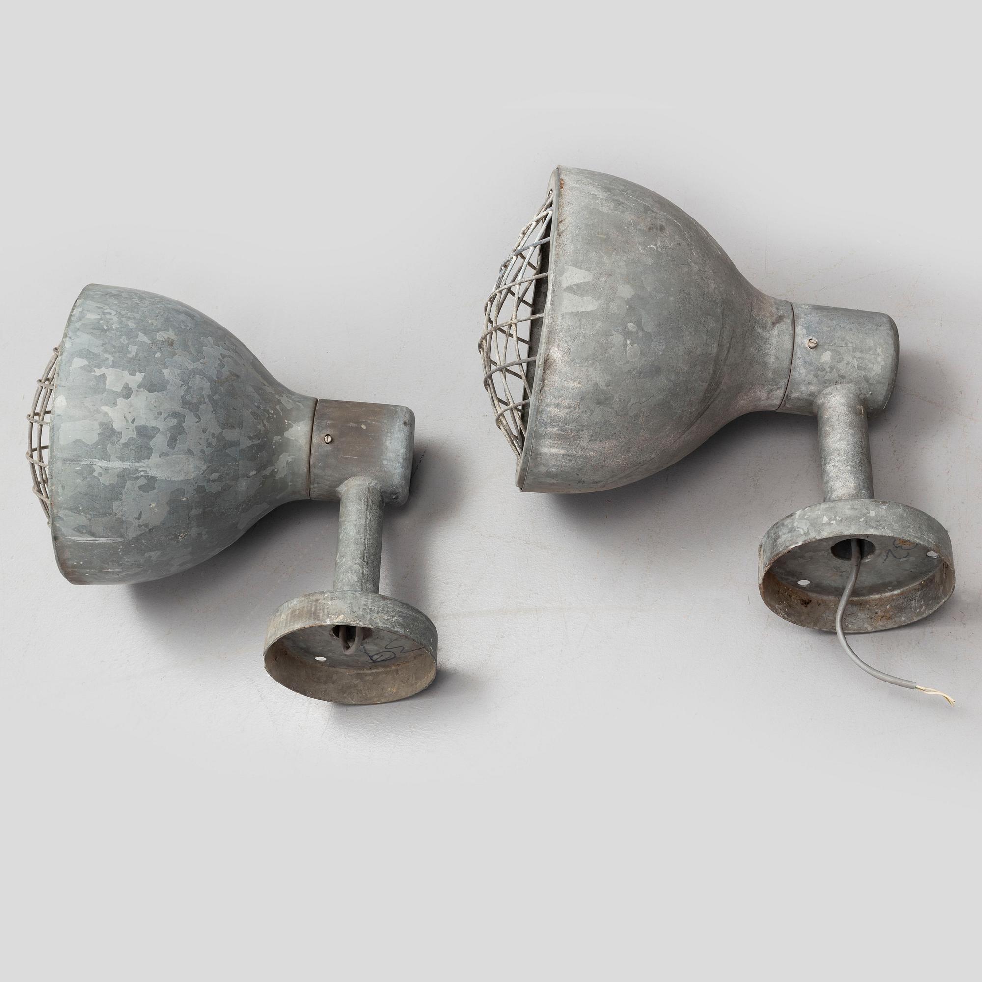 A pair of industrial wall lamps.