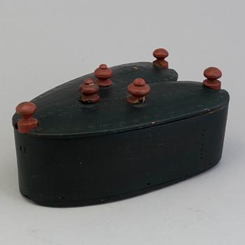 A 19th century folks wooden box in the shape of a loveheart, signed ANS.