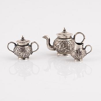 A Japanese Silver Minature Tea Service, probably early 20th Century, (3 pieces).