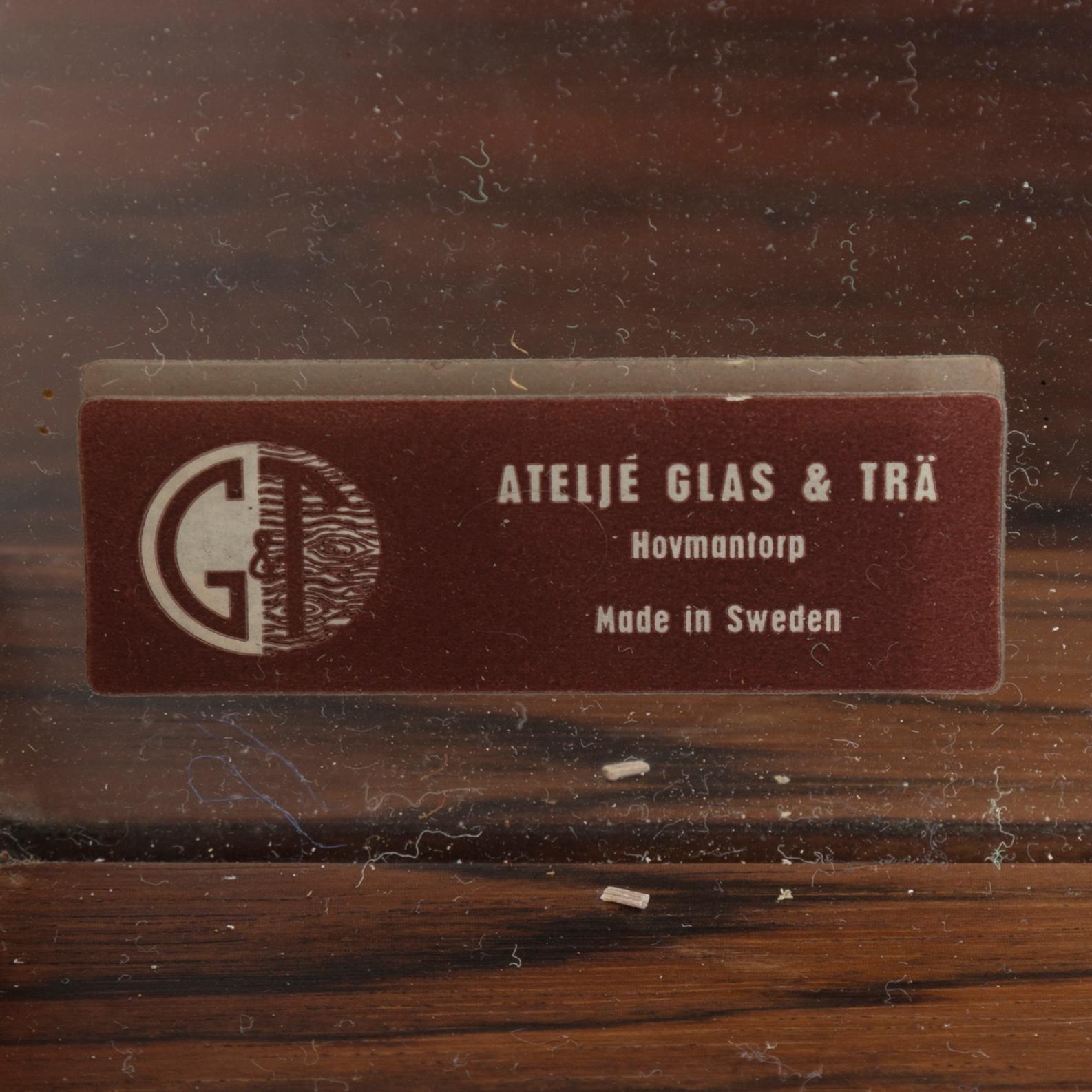 A mirror with a chest of drawer from Ateljé Glas & Trä, mid 20th century.