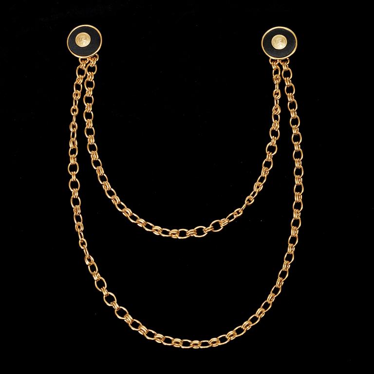 A brooch by Chanel.