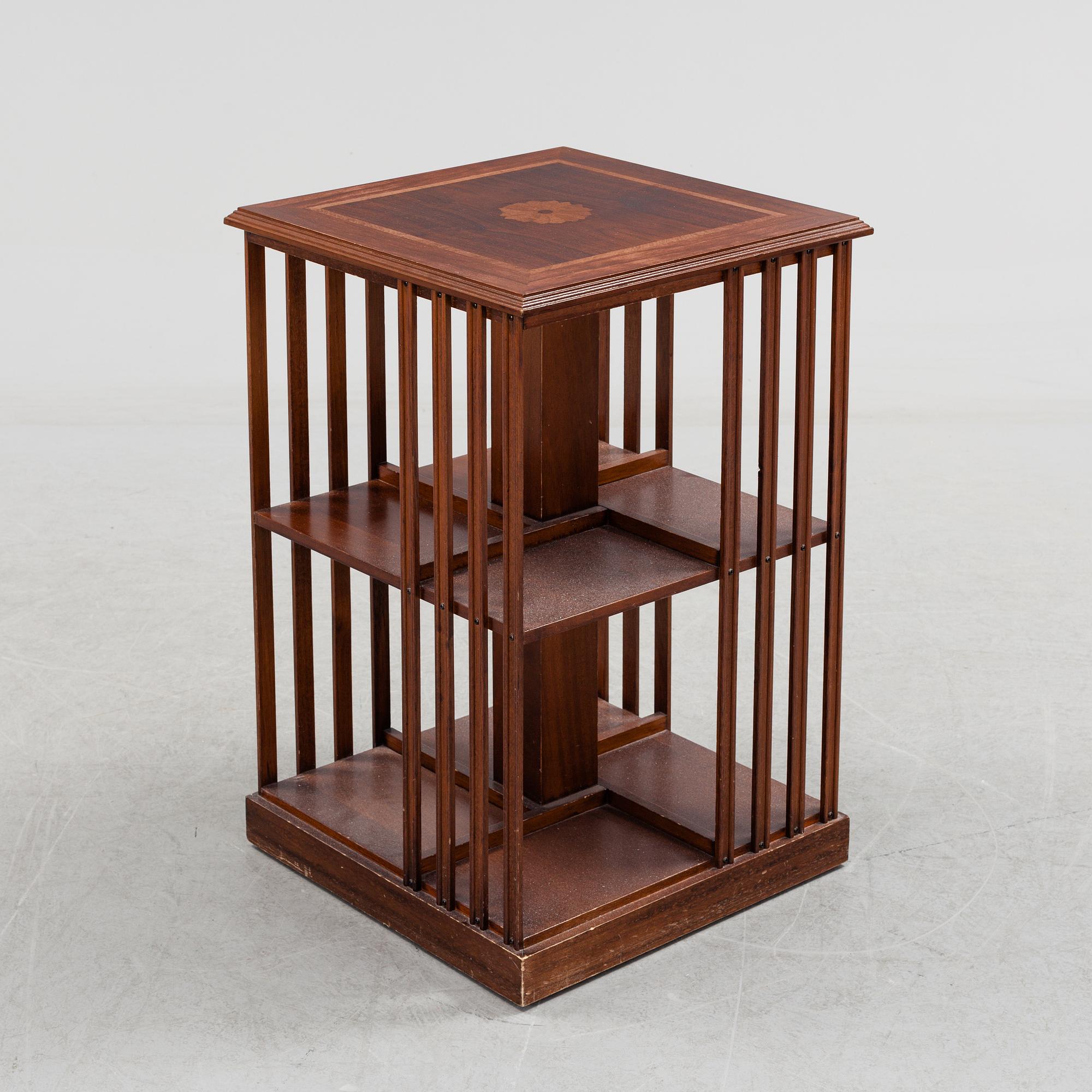 A mahogany veneered revolving bookcase, late 20th Century.