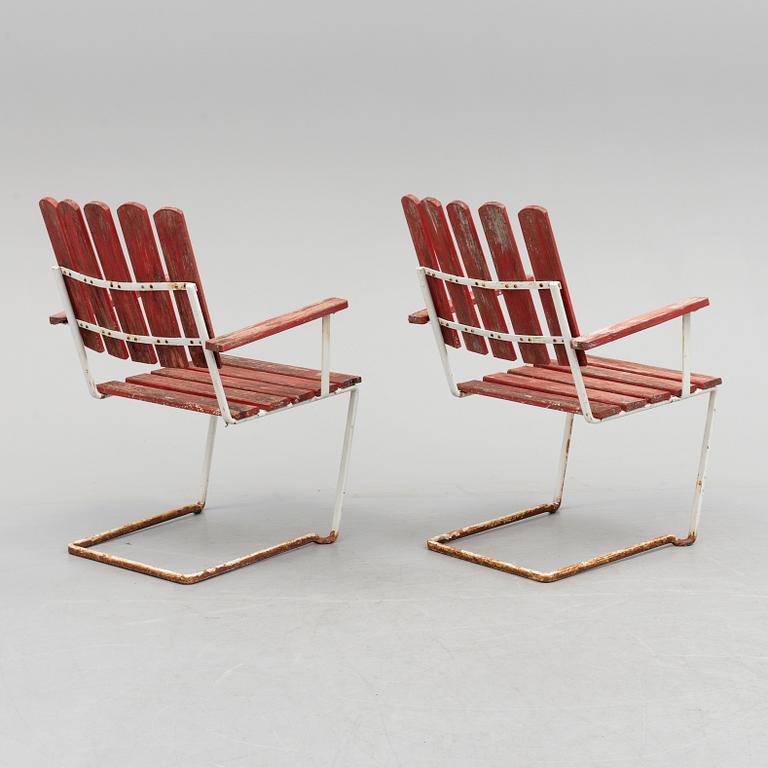 A pair of mid 20th century garden armchairs by Grythyttan stålmöbler.