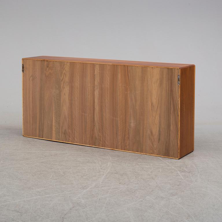 A 1960s walnut veneer wall cabinet.
