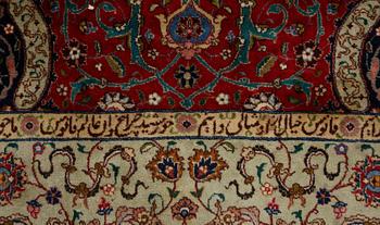 A carpet, semi-antique Tabriz, signed ca 335,5 x 256,5 - 261,5 cm.