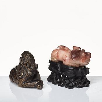 Two sculptures of reclining dogs, Qing dynasty.