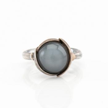 Ole Lynggaard, ring "Lotus" silver, white gold and cabochon-cut moonstone, design Charlotte Lynggaard.