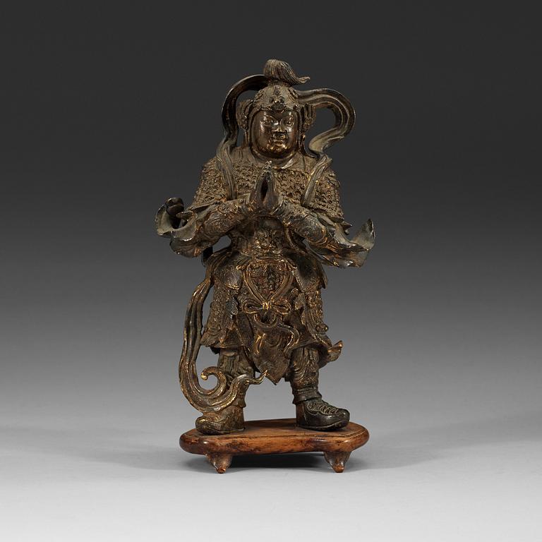 A gilt bronze figure of a Lokapala, Ming dynasty (1368-1644).