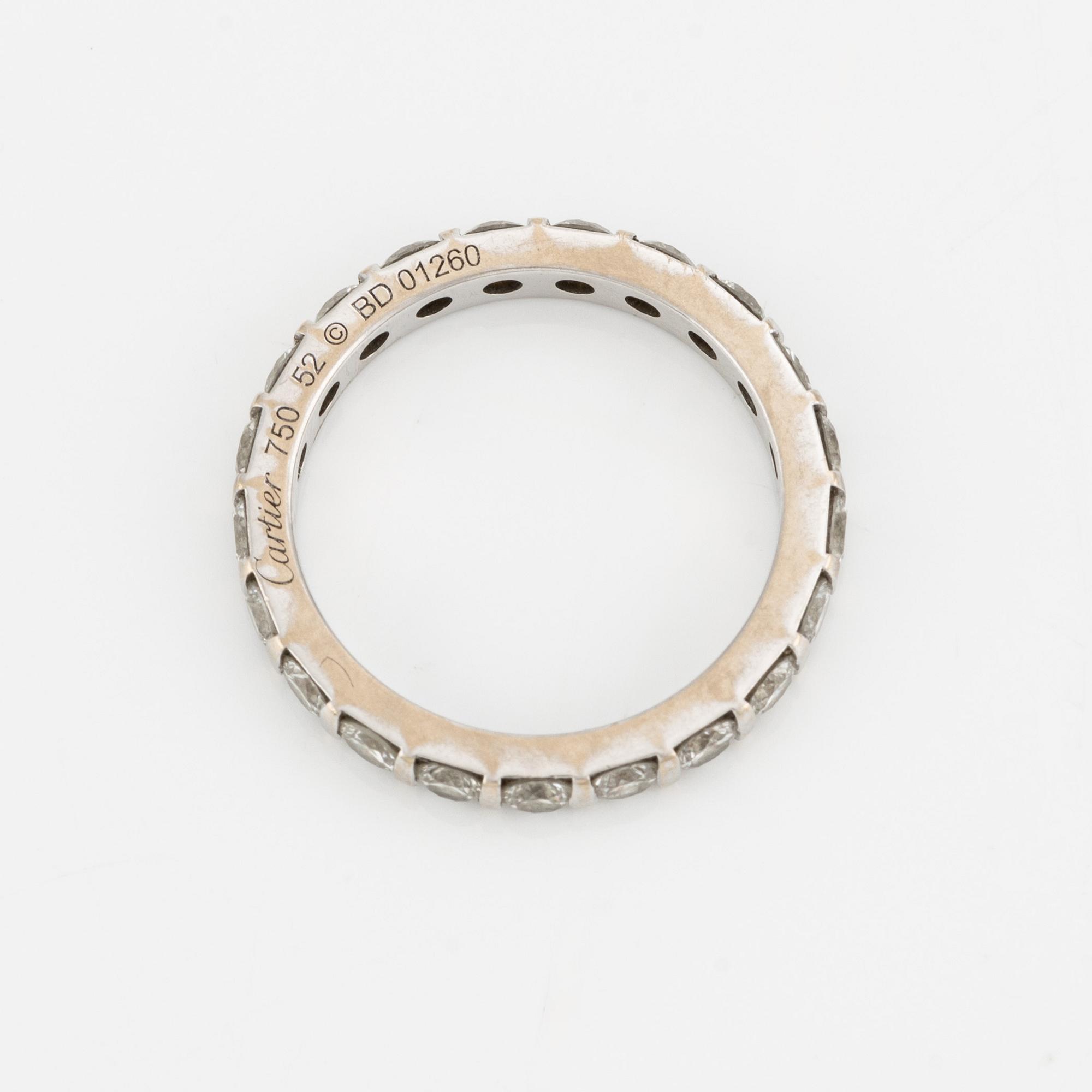 Cartier alliance ring in white gold with round brilliant-cut diamonds.