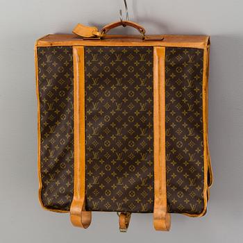 A Louis Vuitton vintage Monogram Canvas Homme Garment Bag.