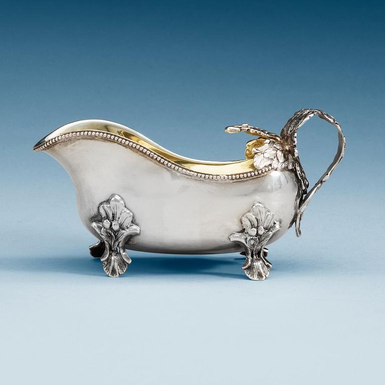 A Swedish 18th century parcel-gilt cream-jug, makers mark of Anders Schotte, Uddevalla 1793.