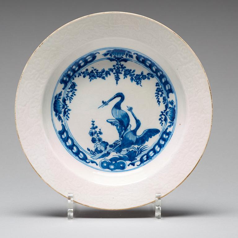 A set of eight blue and white armorial soup dishes, Qing dynasty, 18th Century.