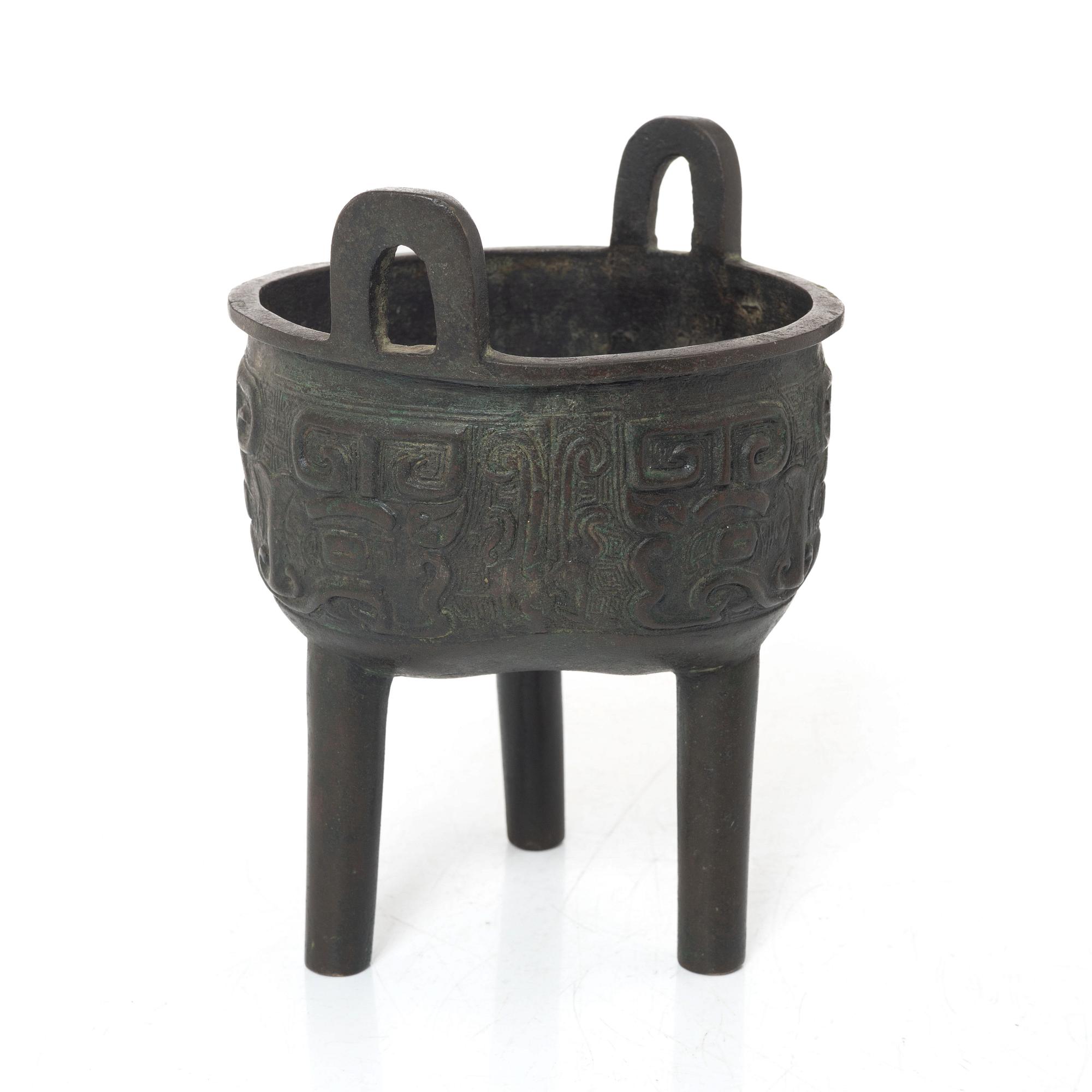A Chinese tripod bronze censer, Ming style, Qing dynasty (1644-1912).