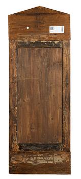 A mahogany-veneered Empire mirror, mid 19th century.