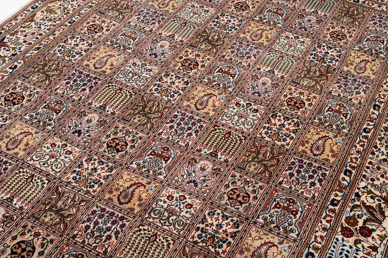 A Moud carpet, part silk, approx. 285 x 195 cm.