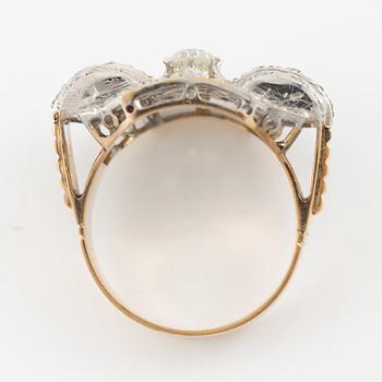 Ring in 18K gold and platinum set with an old-cut diamond and rose-cut diamonds.