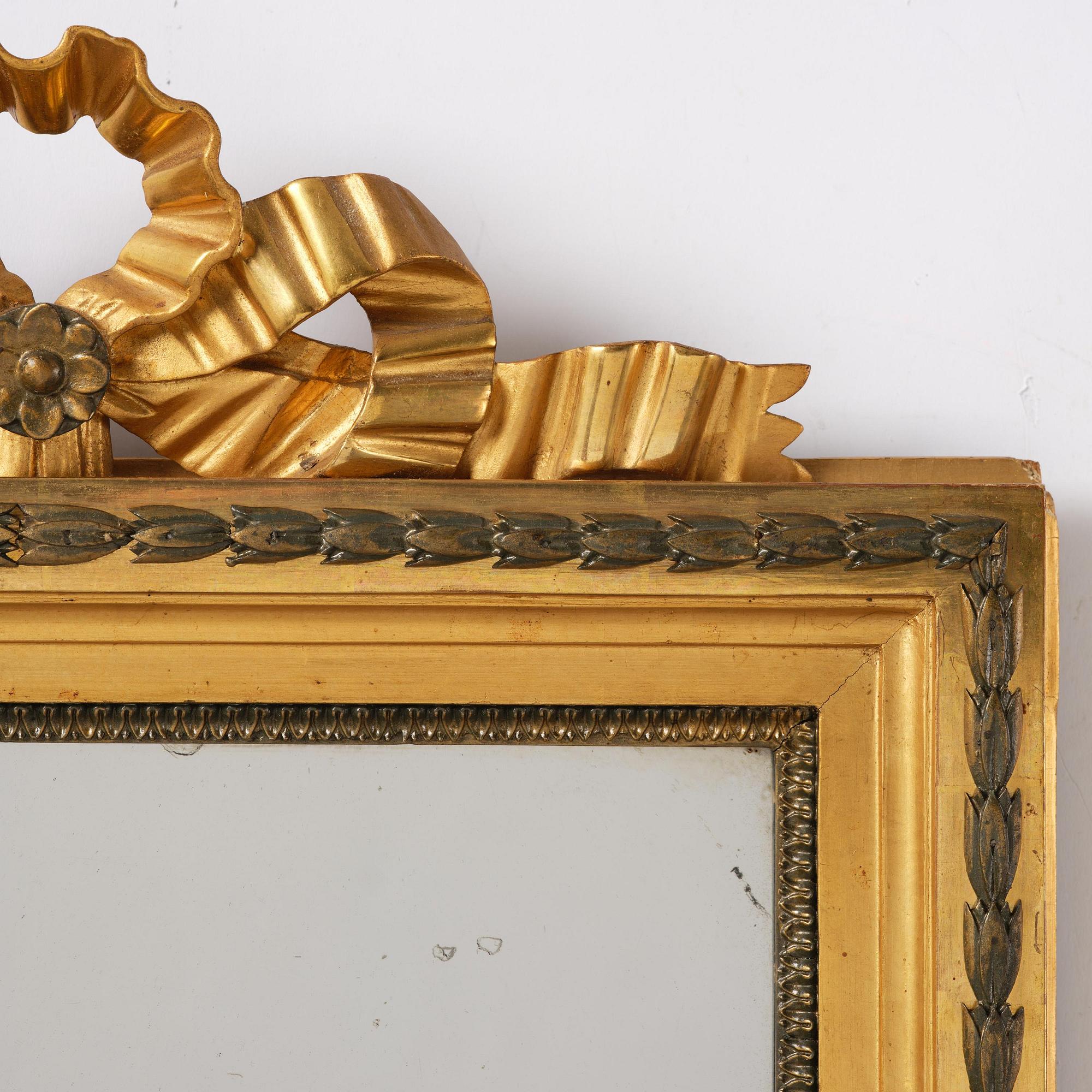 A pair of two-branch giltwood girandole mirrors attributed to P. Ljung (1743-1819).