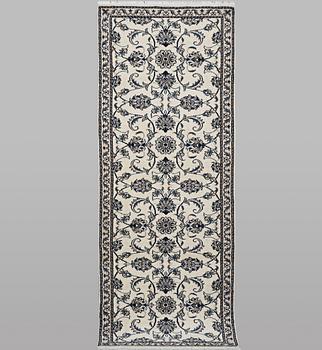 A runner carpet, Nain, part silk, ca 248 x 72 cm.