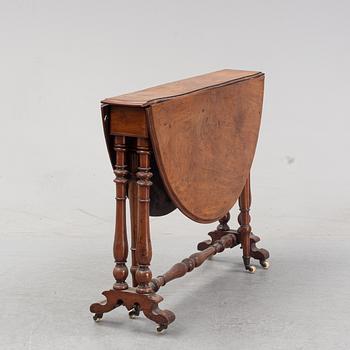 A neo-renaissance mahogany drop-leaf table from secord half of 19th century.